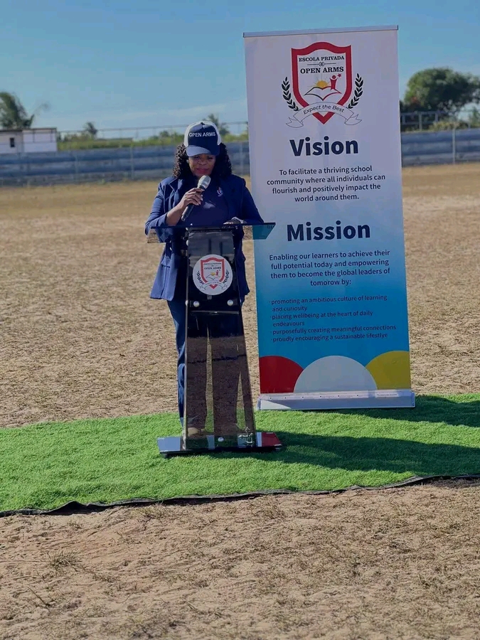 The director speaking at an outdoor event